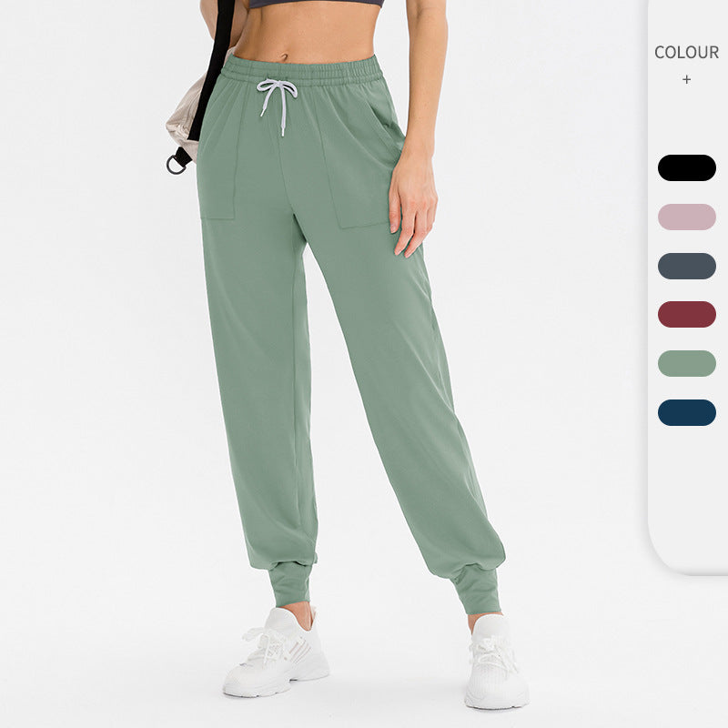 Dame Sporty Joggingbukser med praktiske lynlåslommer og fleksibel talje Stilla