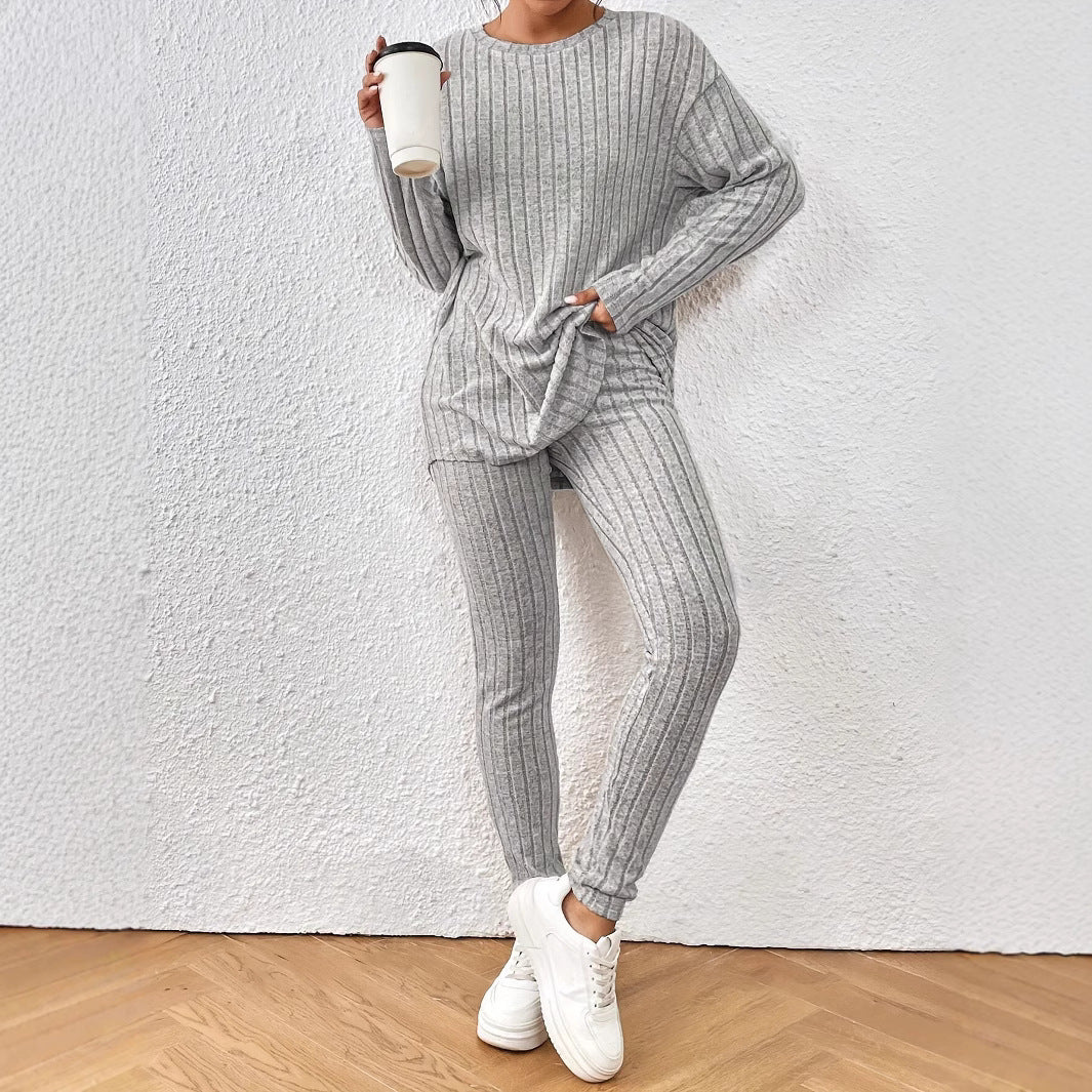 Dame afslappet langærmet top med praktisk lommefunktion og matchende leggings Stilla