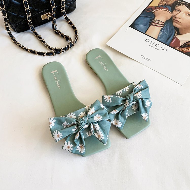 Dame fashionable slippers med legende blomsterdesign og elegante sløjfer Stilla