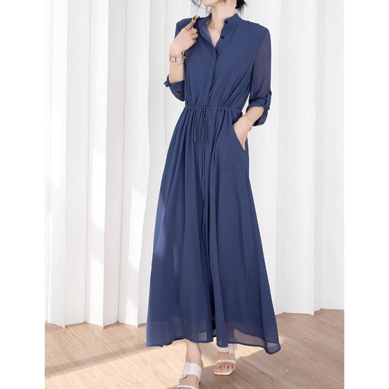 Dame stilfuld jumpsuit med elegant ståkrave og praktiske lommer Stilla