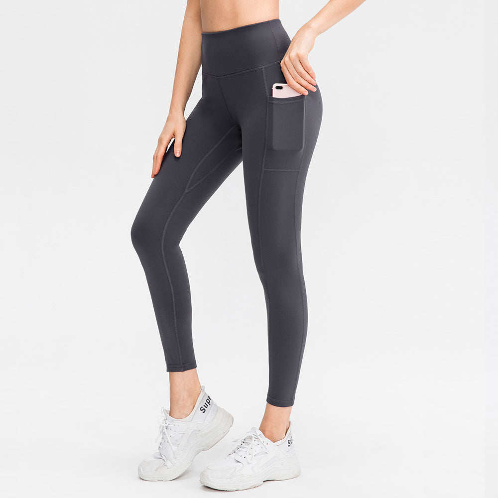 Dame højt skårne fitness leggings med praktiske sidelommer og fleksibelt materiale Stilla