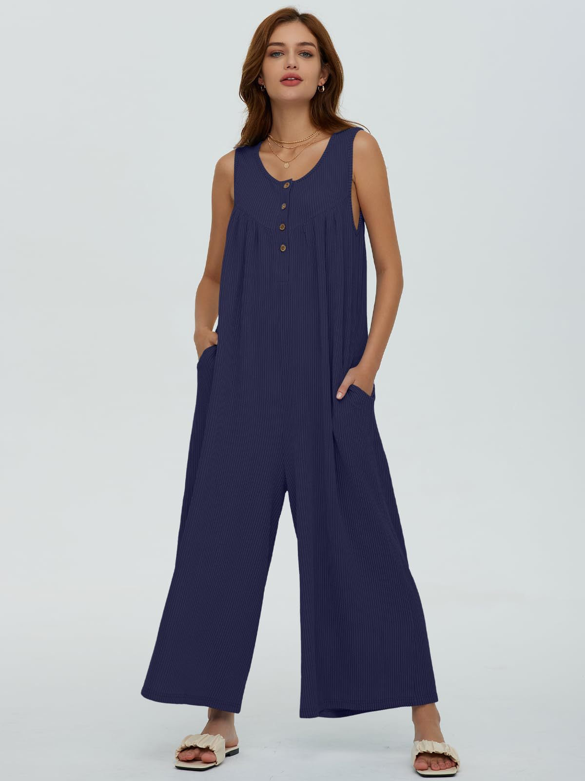 Dame afslappet jumpsuit med vidde ben og knapdetaljer Stilla