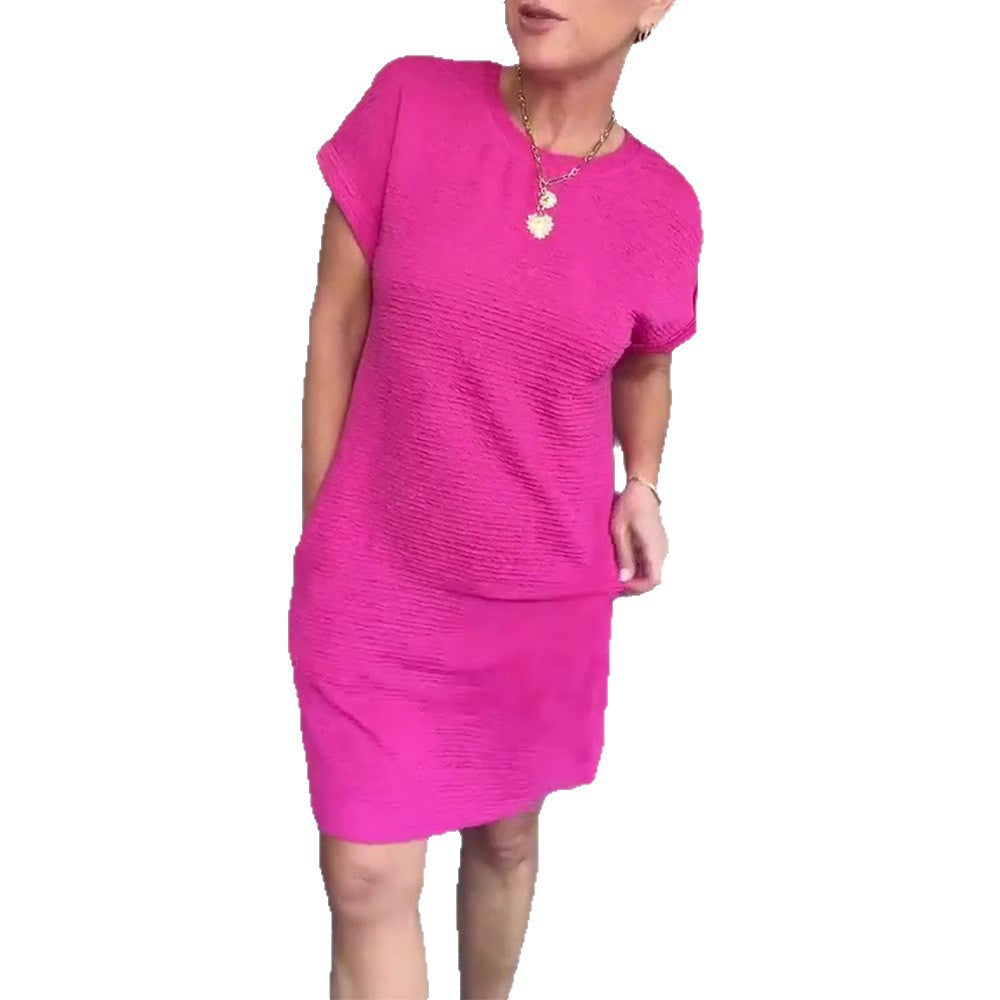 Dame afslappet kortærmet kjole med praktiske sidelommer og struktureret design Stilla