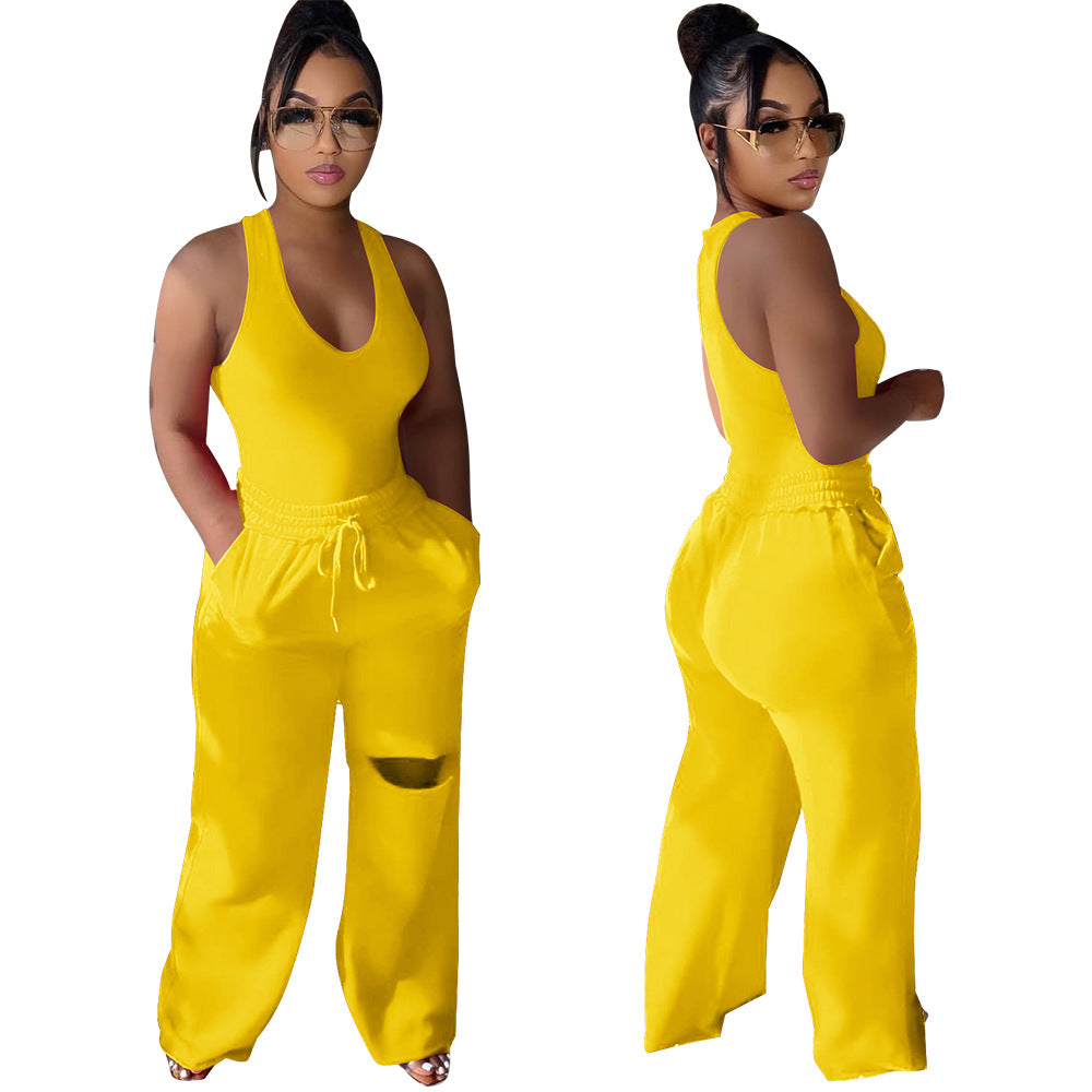 Dame sportlig jumpsuit med dyb V-udskæring og innovative lommer Stilla