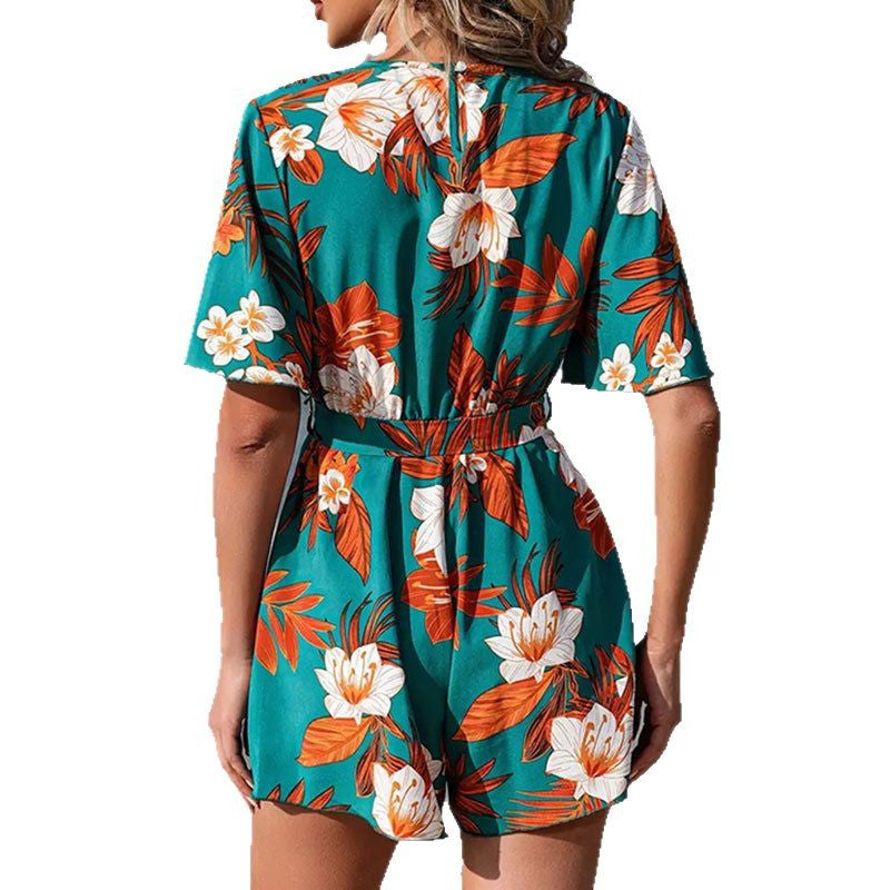 Dame Elegant Wrap Jumpsuit med blomsterdesign og svajende ærmer Stilla
