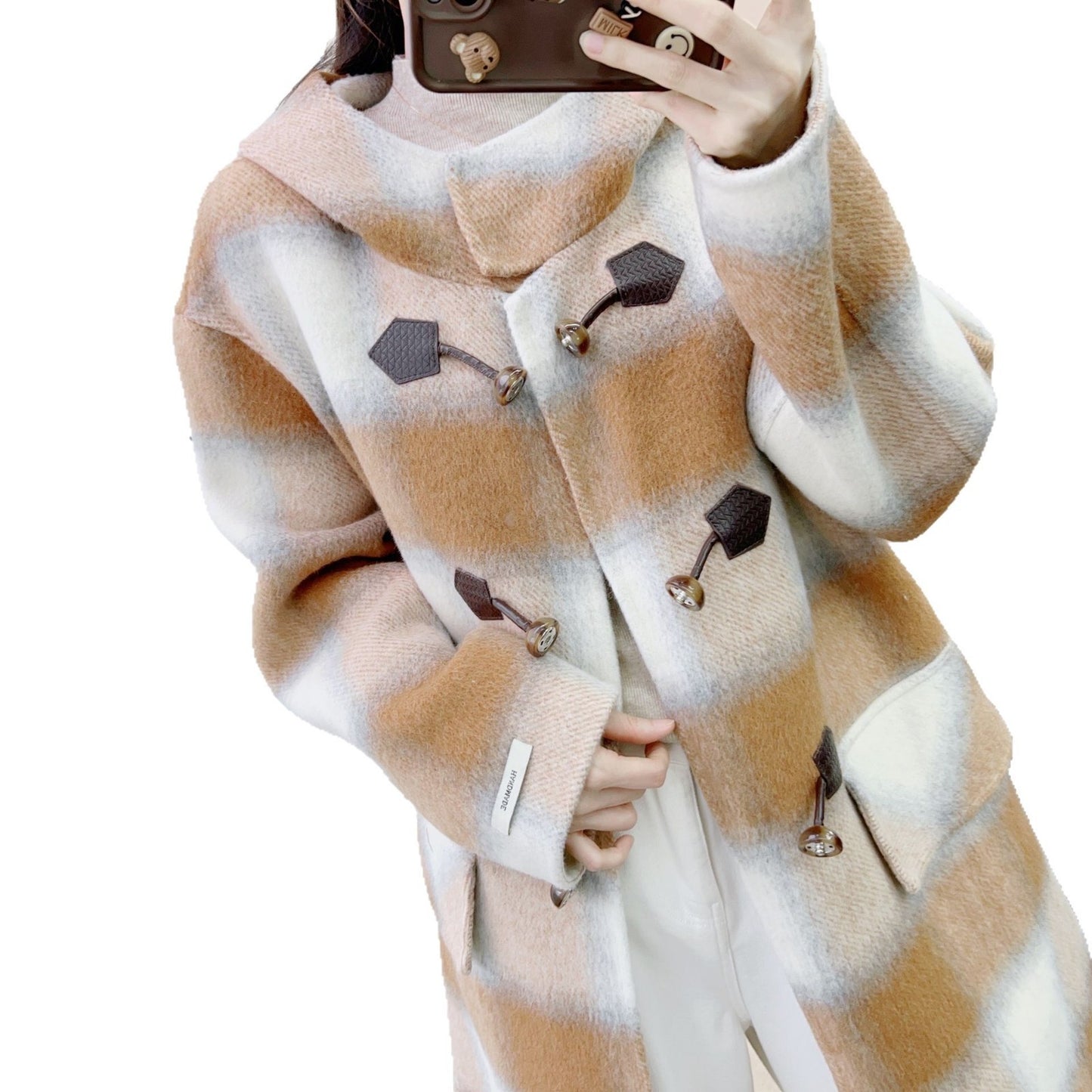 Dame Designer-frakke med innovativ knaplukning og rutemønster Stilla