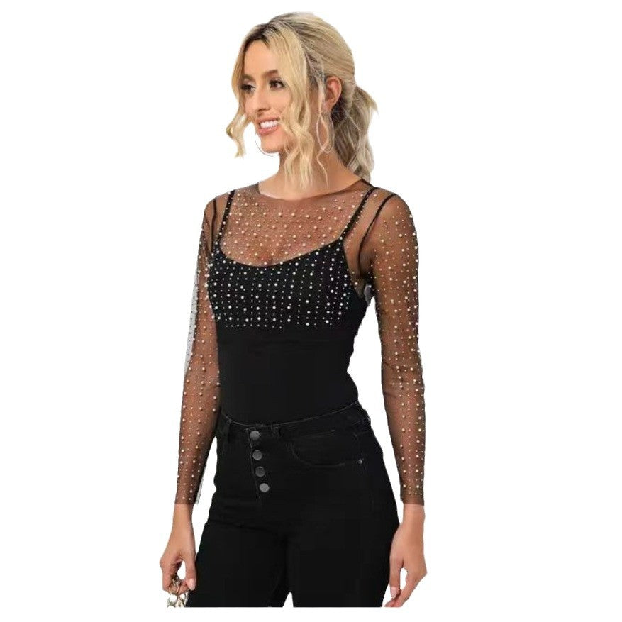 Dame elegant bodysuit med transparente ærmer og glitrende detaljer Stilla