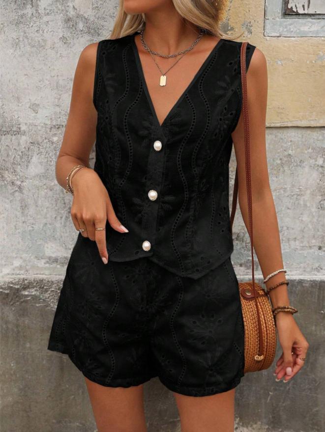Dame kort jumpsuit med blomsterbort design og perleknapper Stilla