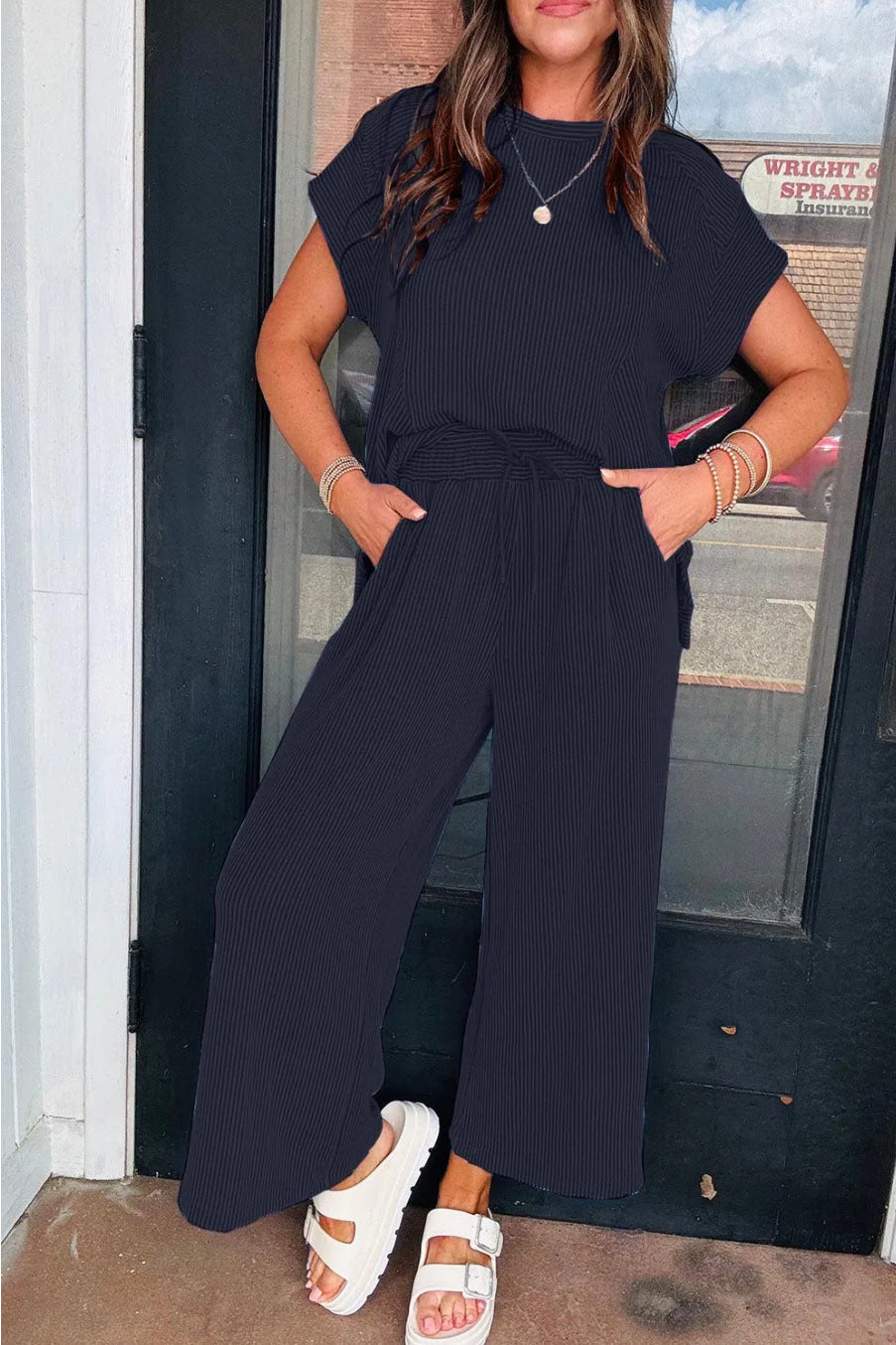 Dame afslappet strik-jumpsuit med brede ben og elastisk talje Stilla