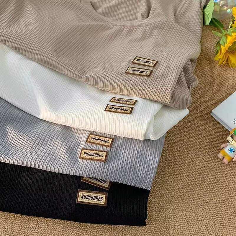 Dame afslappet T-shirt med struktureret stof og moderigtig logo Stilla