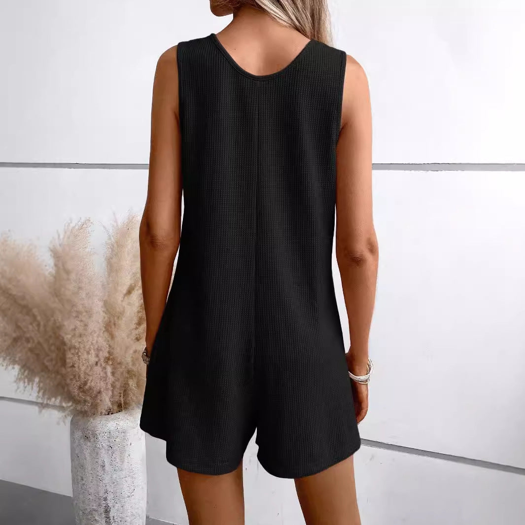 Dame afslappet jumpsuit i åndbart vaffelmønster med knaplukning og praktiske lommer Stilla