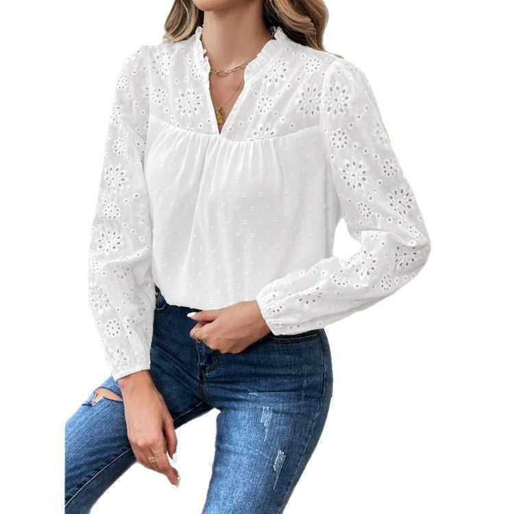 Dame elegant bluse med florale hulmønstre og pufærmer Stilla