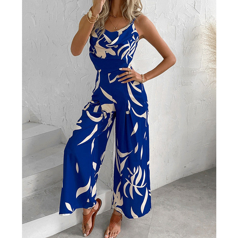 Dame jumpsuit med flydende snit og dekorative blomster motiver Stilla