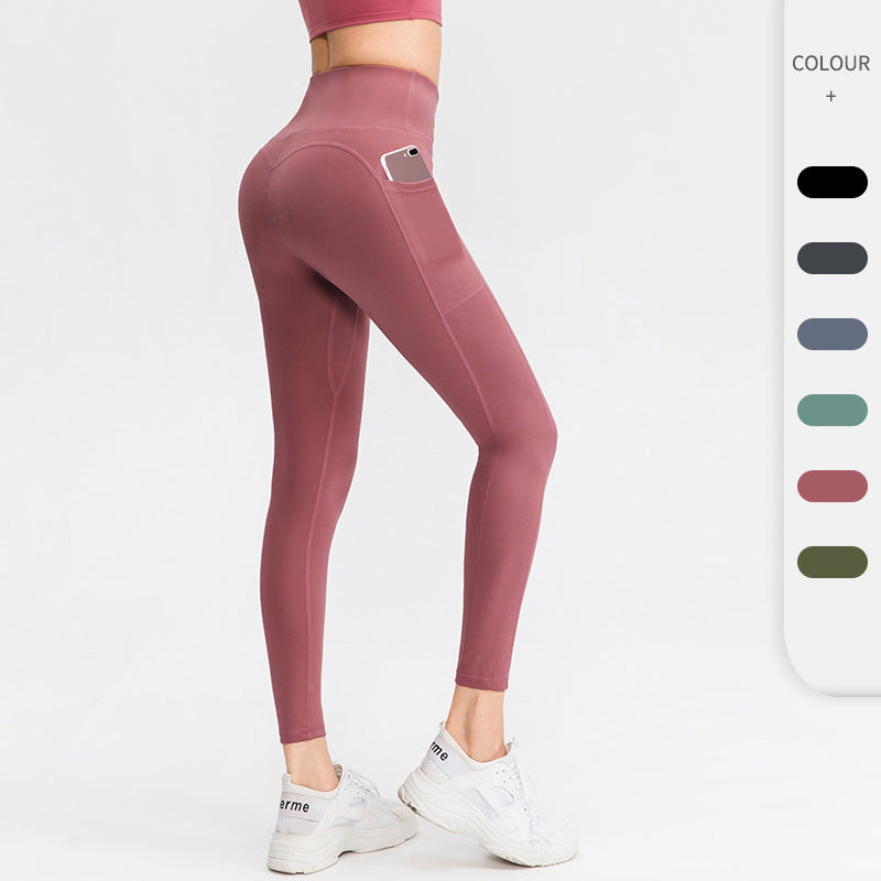 Dame højt skårne fitness leggings med praktiske sidelommer og fleksibelt materiale Stilla