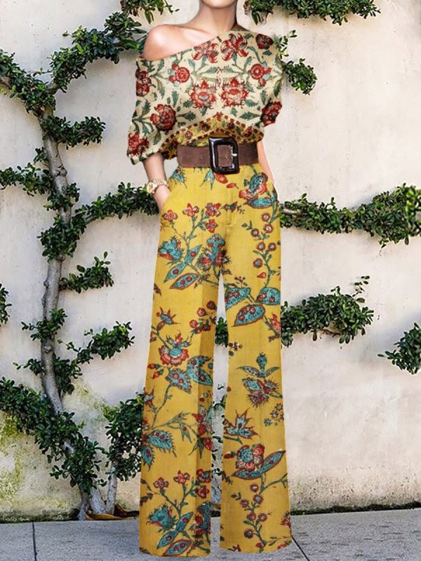 Stilla | Bred Ben Jumpsuit med Skrå Skulder og Print
