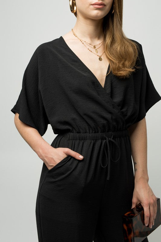 Stilla | Ærme Surplice Jumpsuit