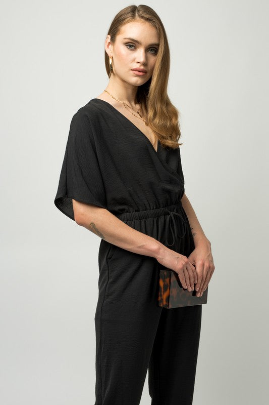 Stilla | Ærme Surplice Jumpsuit