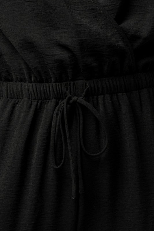 Stilla | Ærme Surplice Jumpsuit