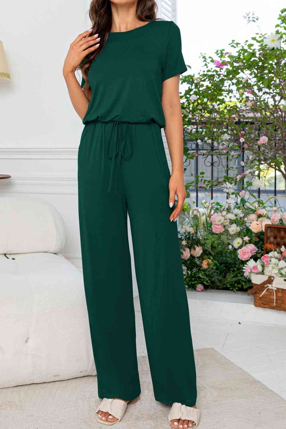 Stilla | Hals Åben Bag Jumpsuit Med Lommer