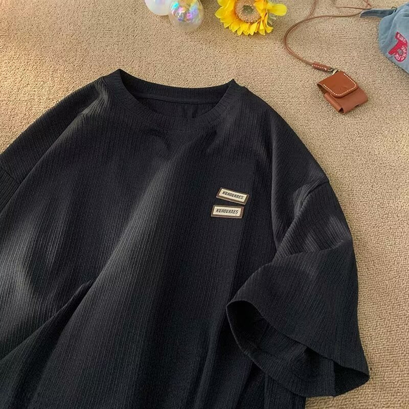 Dame afslappet T-shirt med struktureret stof og moderigtig logo Stilla