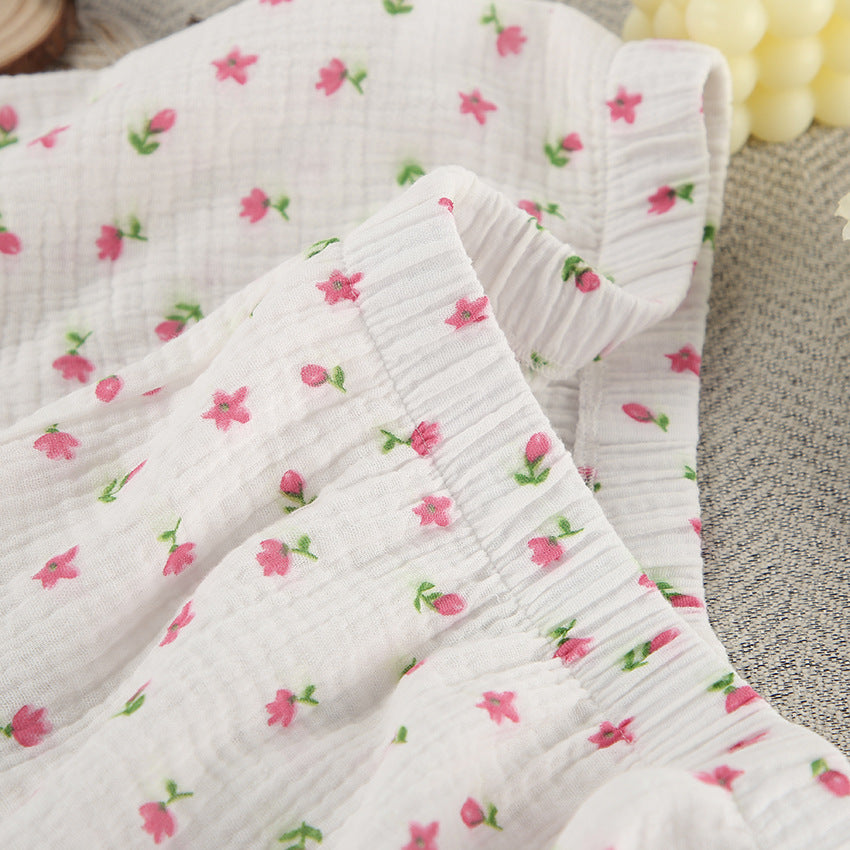 Dame afslappet pyjamasæt med blomsterprint og behagelige knapdetaljer Stilla