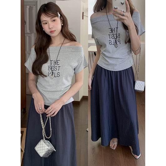 Dame afslappet off-shoulder T-shirt med kreativt tryk Stilla