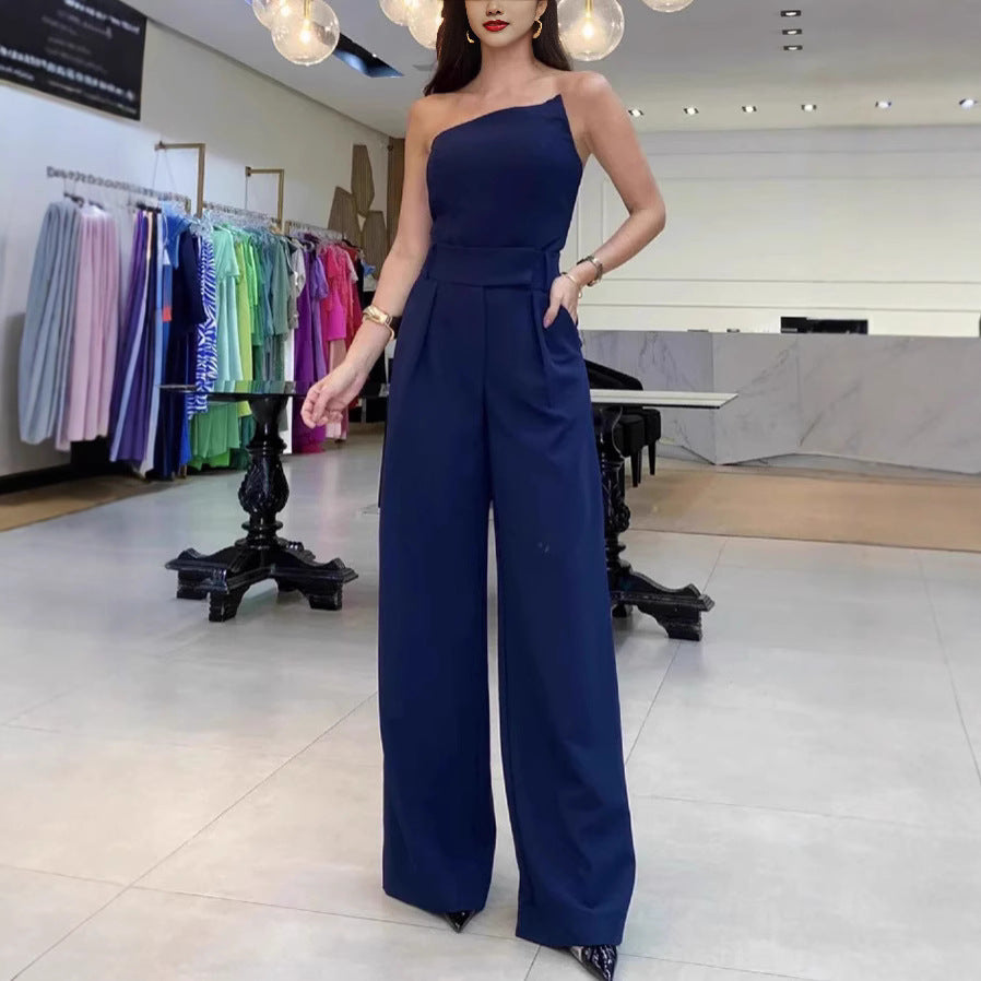 Dame Elegant jumpsuit med asymmetrisk skæring og bredt ben Stilla