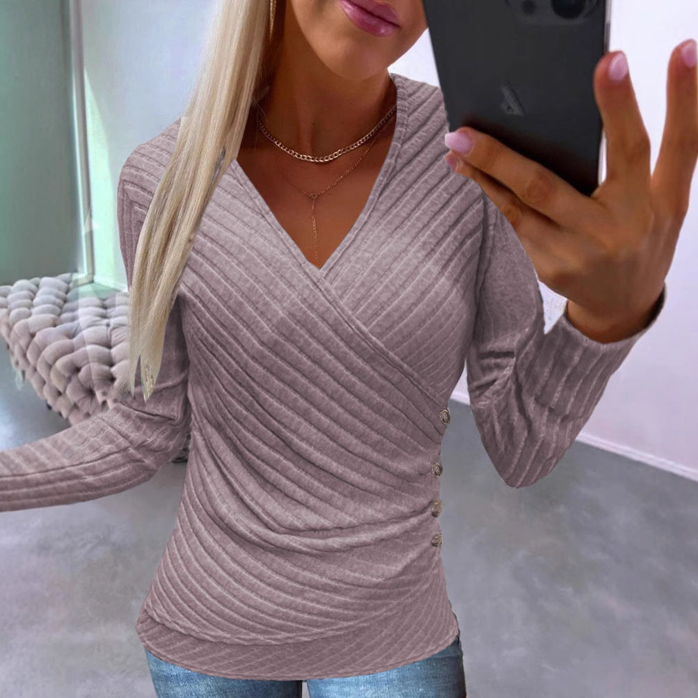 Dame elegant indpakningstop med struktureret design og dekorative knapper Stilla