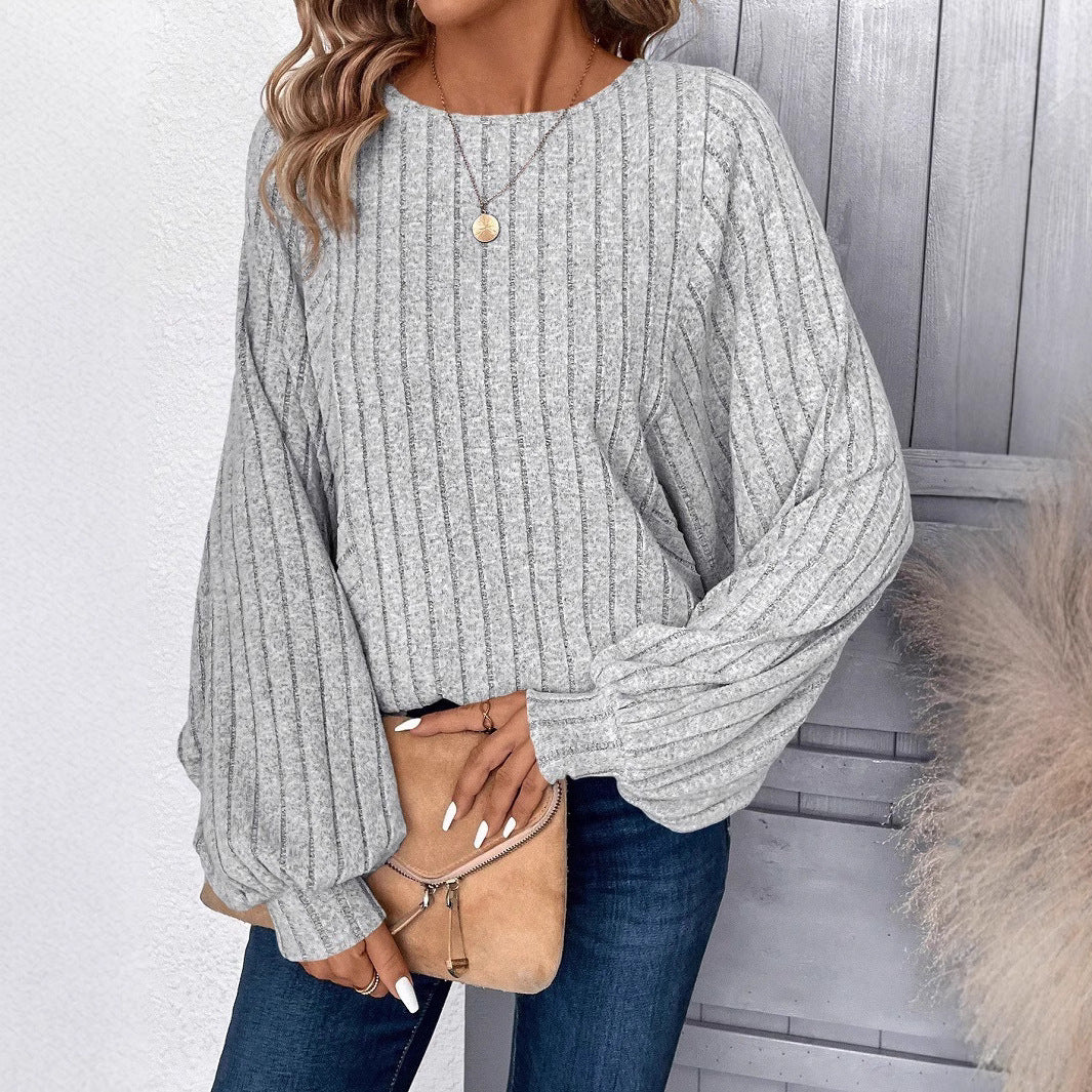 Dame sweater med elegante ballonærmer og ribbestruktur Stilla