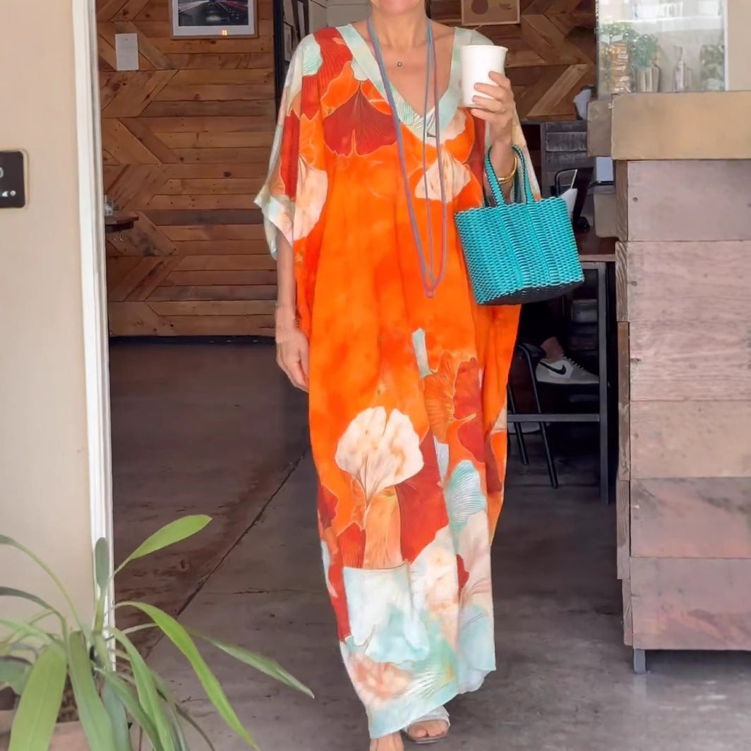 Dame Elegant kaftan-kjole med blomsterdesign og brede ærmer Stilla