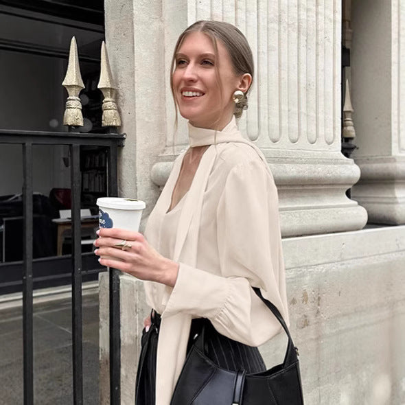 Dame elegant bluse med asymmetrisk binde detalje og voluminøse ærmer Stilla