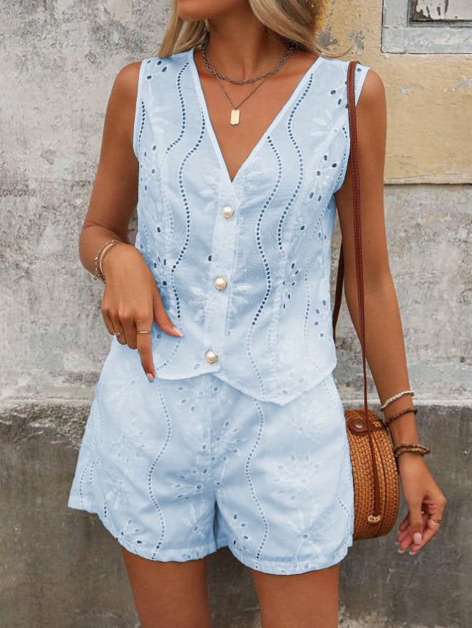 Dame kort jumpsuit med blomsterbort design og perleknapper Stilla
