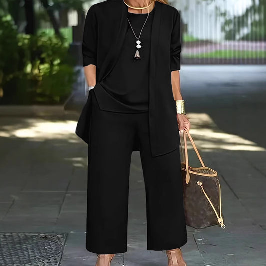 Dame Elegante og komfortabel todelt outfit med brede bukser og flydende top Stilla