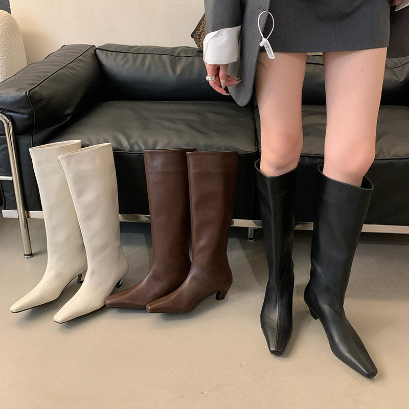 Dame støvler med elegant spids tå og struktureret design Stilla
