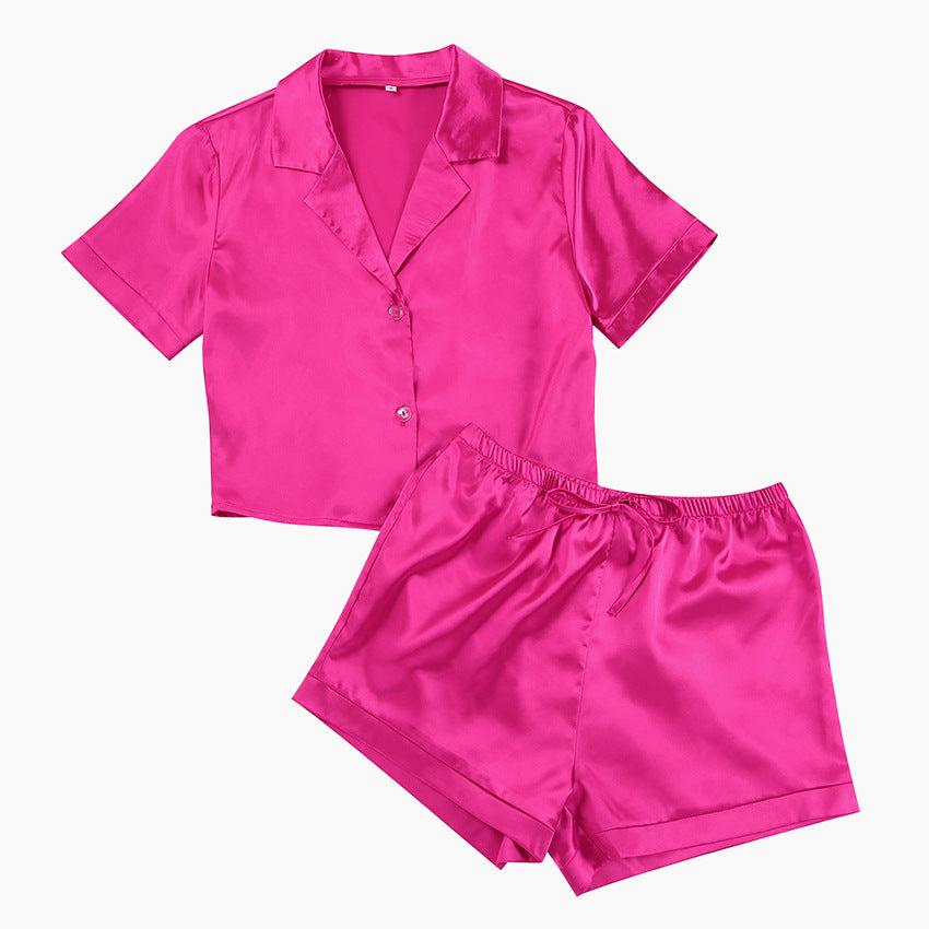 Dame elegant kort jumpsuit med flot krave og knapdetaljer Stilla