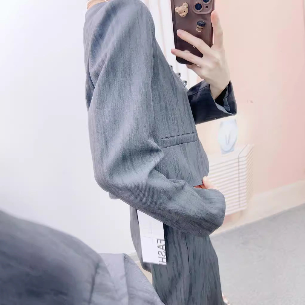 Dame Elegant Blazer-Bukser-Kombination med struktureret design og moderne knapdetaljer Stilla