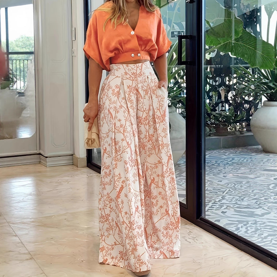 Dame elegant crop-top med knapdetaljer og maxiskirt med blomsterprint Stilla