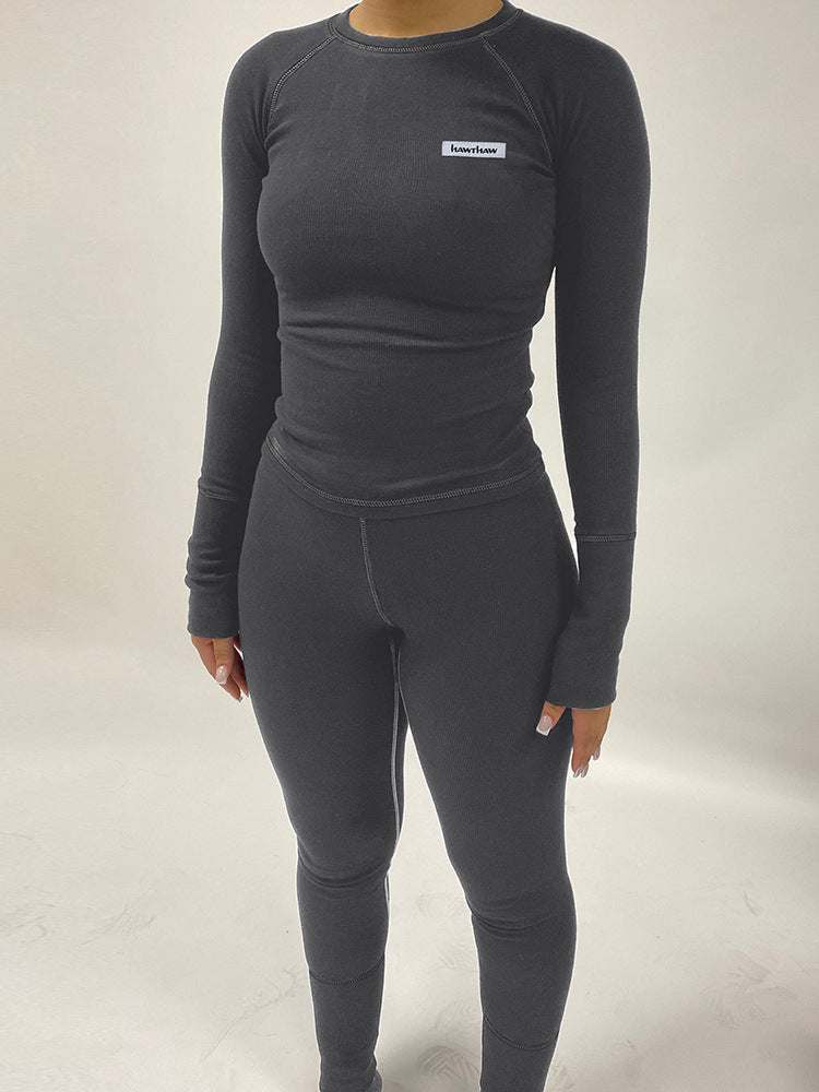 Dame leggings-sæt med langærmet top og figurskabende design Stilla