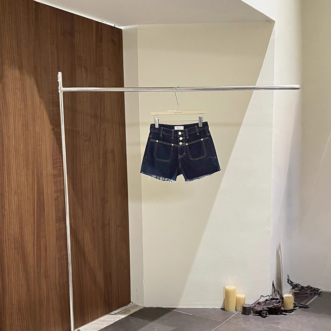 Dame Denim-shorts med knapdetalje og afslappet design Stilla