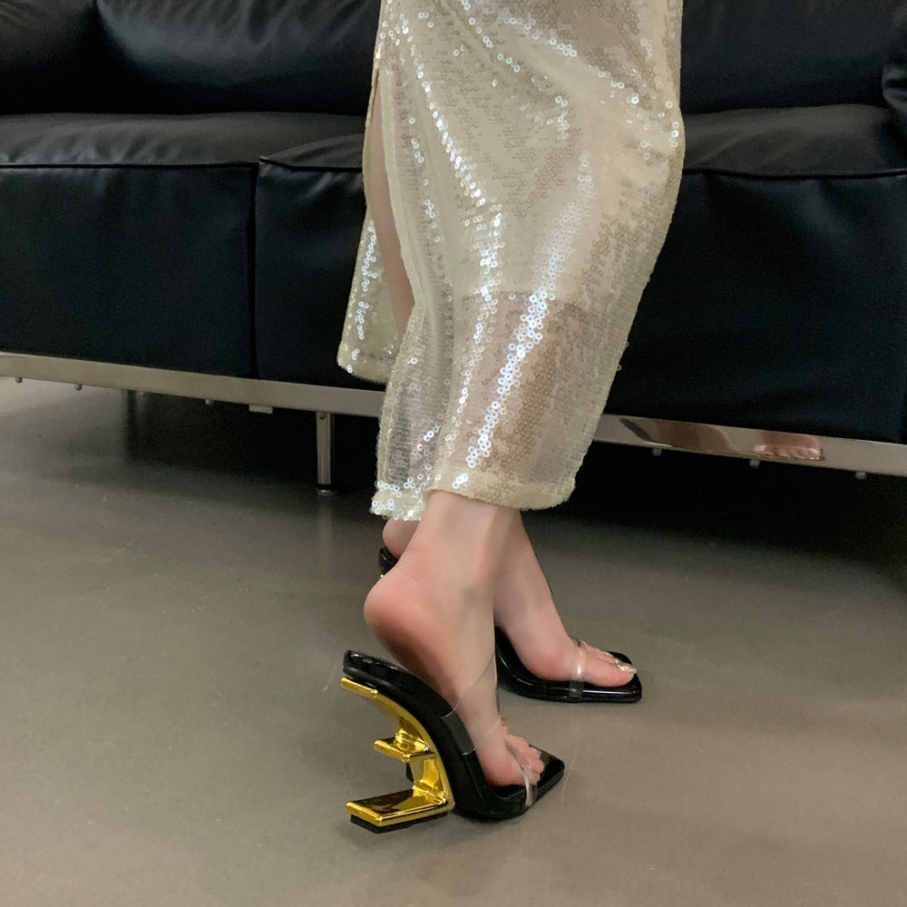 Dame åbne højhælede mules med transparent overmateriale og elegant metallisk accent Stilla