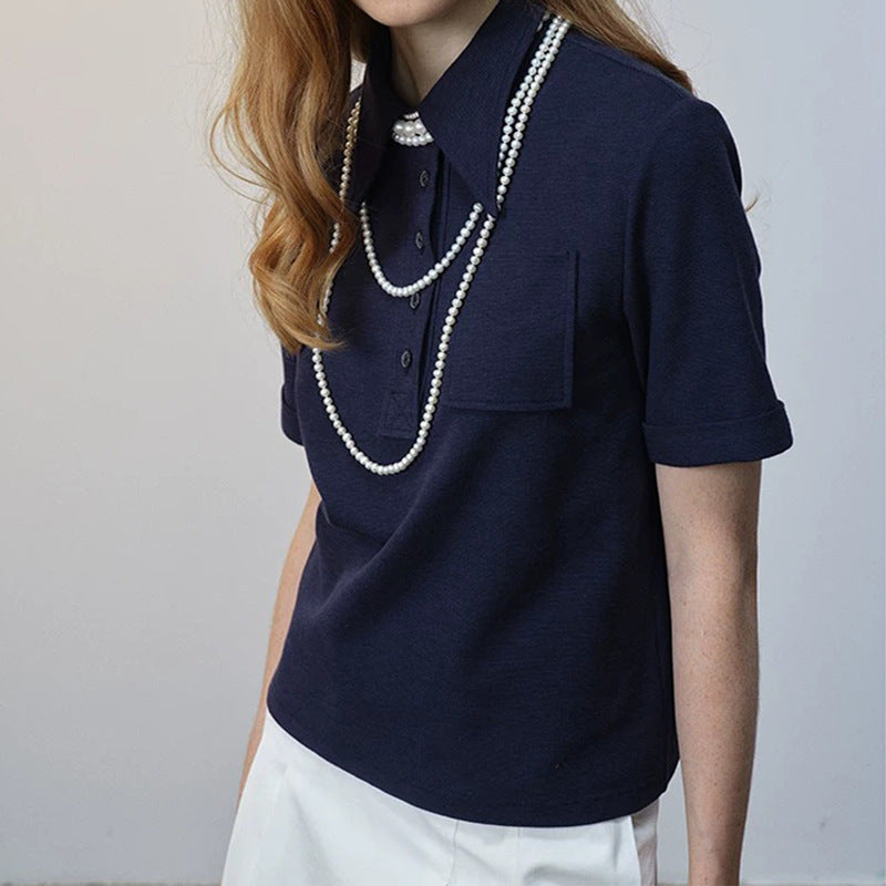 Dame polo shirt med klassisk krave og dekorerende knapdetaljer Stilla