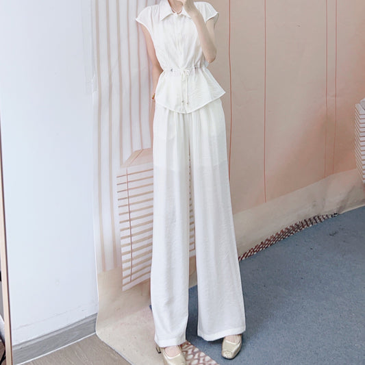 Dame jumpsuit med taljerbart design og elegante knapdetaljer Stilla