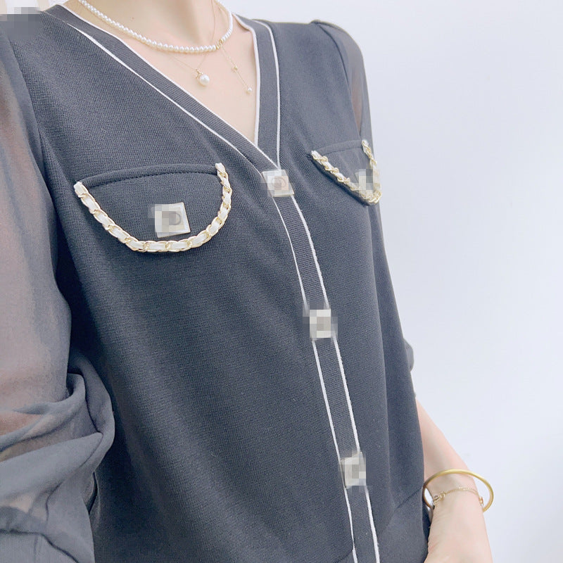 Dame elegant bluse med transparente ærmer og dekorative knapdetaljer Stilla