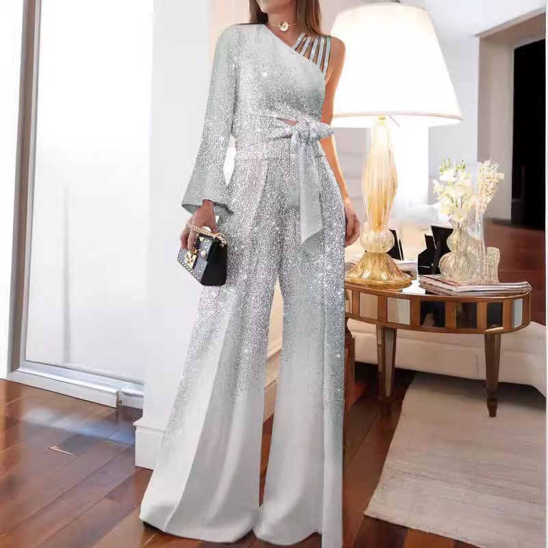 Dame elegant ensidig jumpsuit med glimmerdetaljer og bred ben Stilla