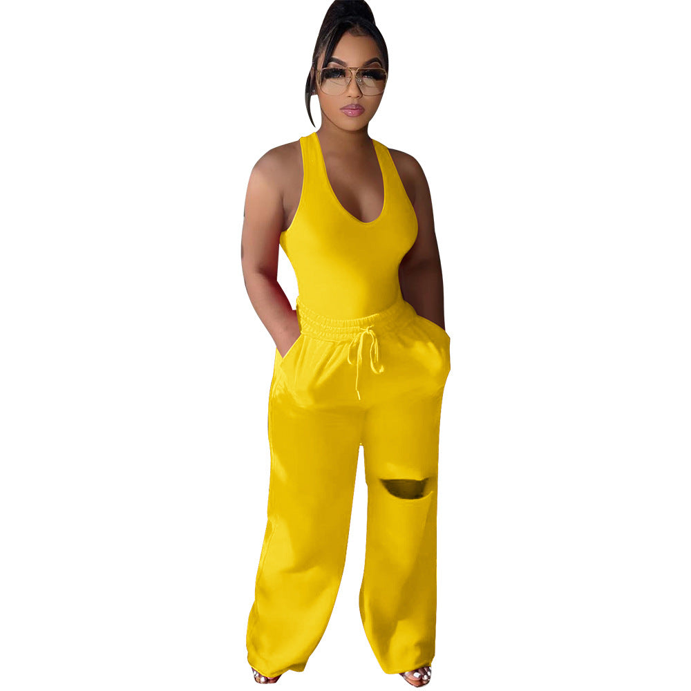 Dame sportlig jumpsuit med dyb V-udskæring og innovative lommer Stilla