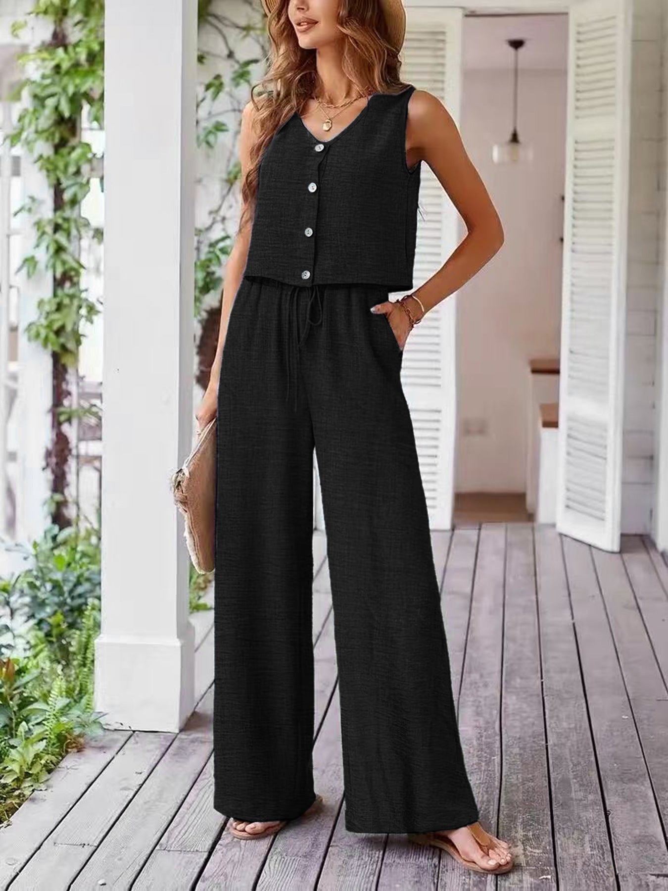 Dame leger jumpsuit med knaplukning og bredt ben Stilla
