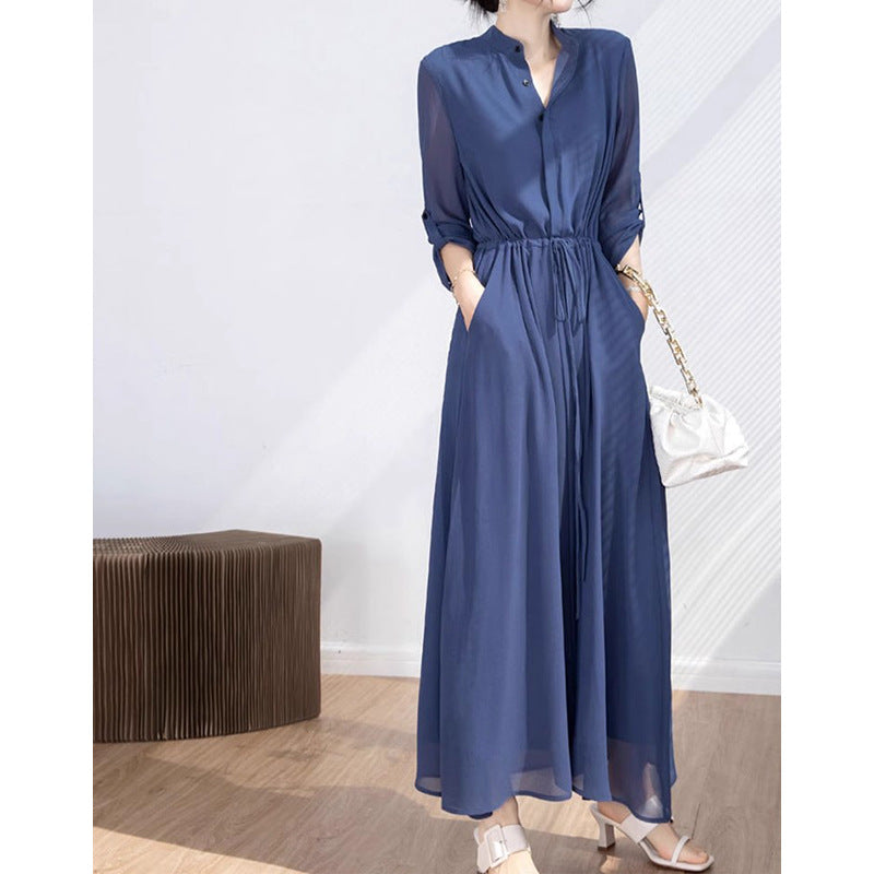 Dame stilfuld jumpsuit med elegant ståkrave og praktiske lommer Stilla