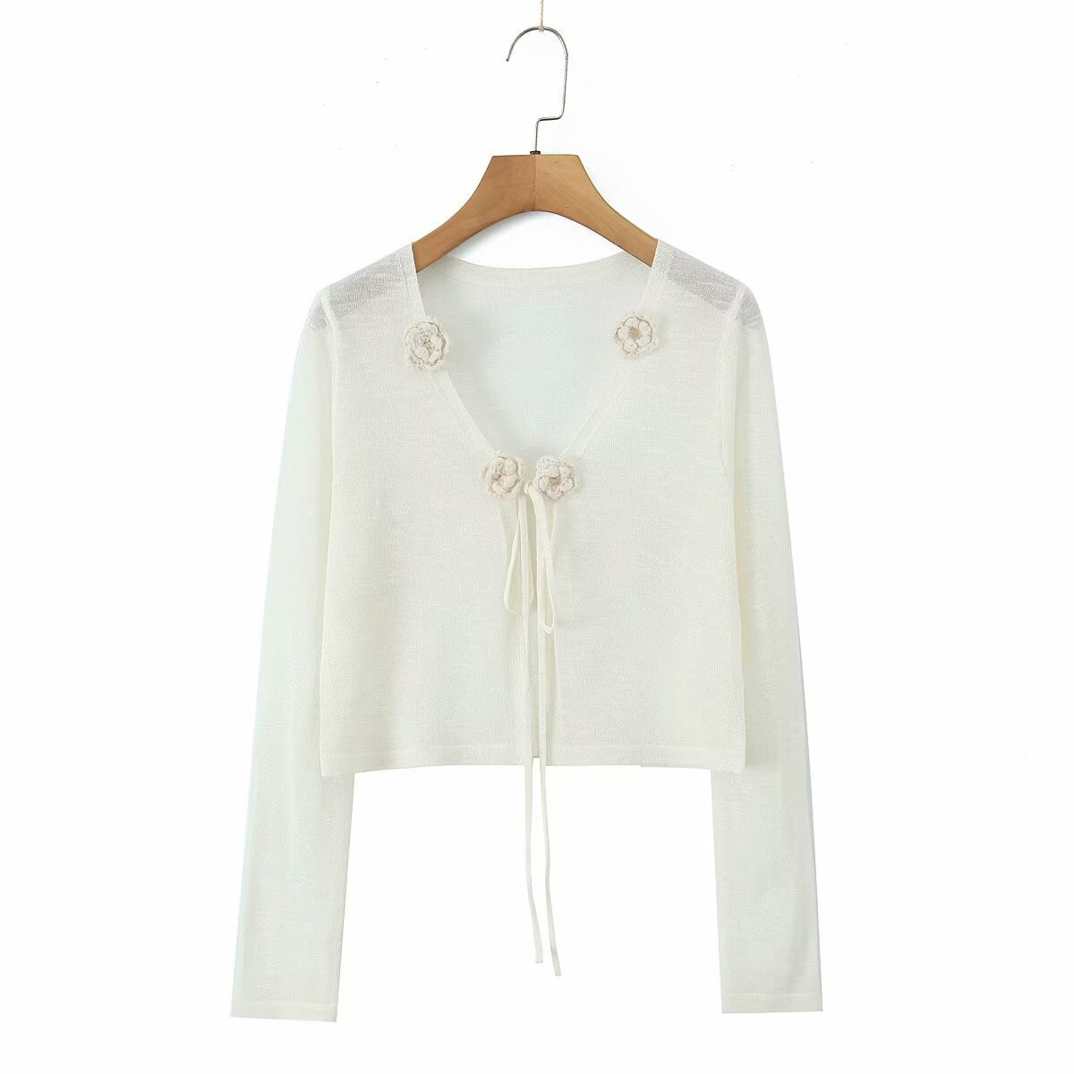 Dame cropped strikjakke med blomstrede accenter og elegant bindebånd Stilla