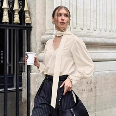 Dame elegant bluse med asymmetrisk binde detalje og voluminøse ærmer Stilla