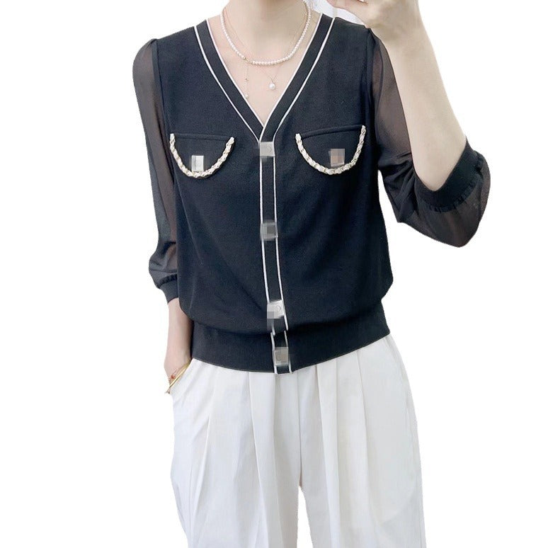 Dame elegant bluse med transparente ærmer og dekorative knapdetaljer Stilla